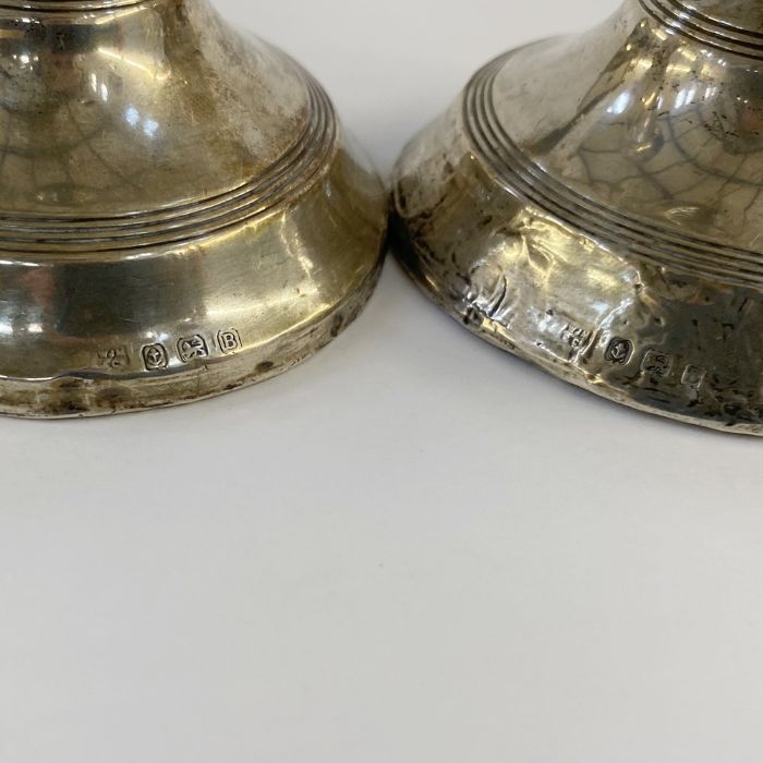 Pair of 1920's silver-mounted squat candlestick holders, Birmingham 1926, maker's mark worn, 12. - Image 2 of 3