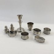 A 1950's silver mounted short candlestick Birmingham 1954, a foreign silver eggcup with relief