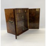 A Victorian burr walnut humidor /cigar cabinet, rebated brass handles to the sides, Bramah lock