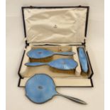 1950's Asprey silver and blue enamel four-piece dressing set with silver initial relief 'EP' (one