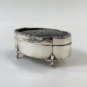 Early 20th century silver and pique tortoiseshell jewellery box, shaped oval with serpentine husk