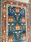 Shirvan wool carpet, the design inspired by a kilim from Kuba region and having green field with