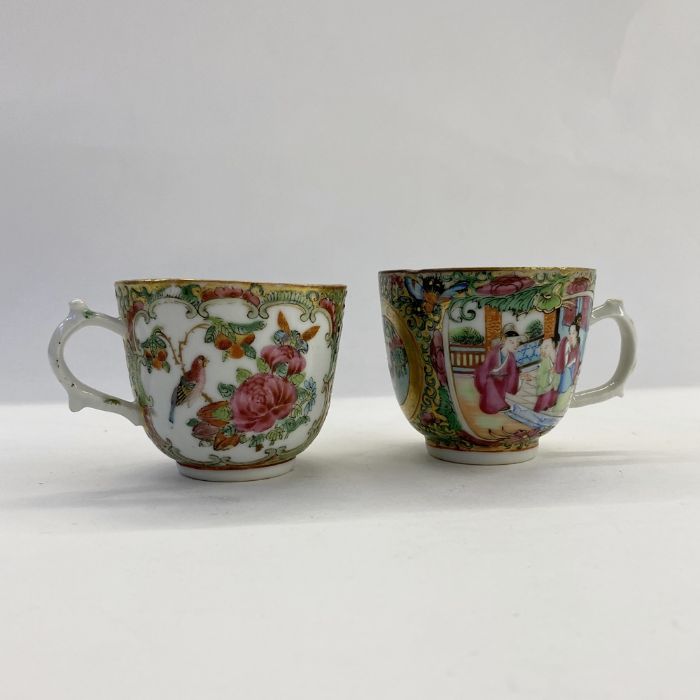 Pair 19th century Chinese canton porcelain cups with panels of figures, flowers and birds, in