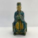 19th century Chinese Sancai glazed terracotta figure, seated man in robes, 23.5cm high Condition
