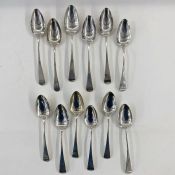 Six Georgian silver dessert spoons, marks worn, Old English pattern, five similar, London 1812 and