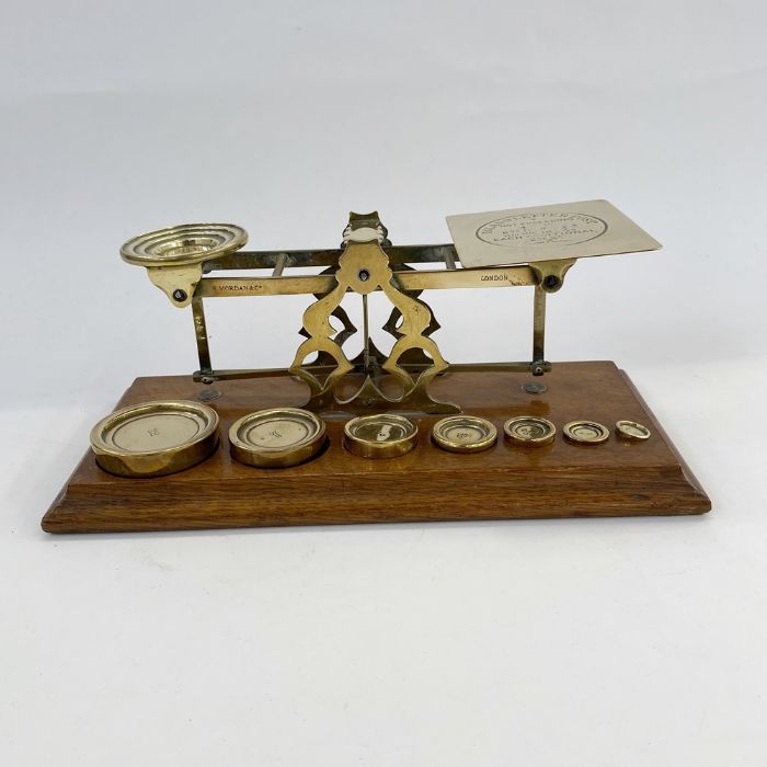 Set of late 19th century Sampson Mordan and Co. postal scales, with seven graduated weights on oak - Image 4 of 4