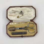 1930's travelling sewing kit with silver thimble, silver needle case in a marked Asprey London box