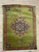 c.1900 Kurdish Feraghan rug, the deep green ground with floral arabesque and having palmettes and