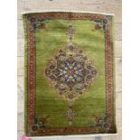 c.1900 Kurdish Feraghan rug, the deep green ground with floral arabesque and having palmettes and