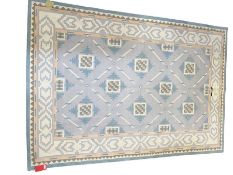 Kilim in pale indigo blue and salmon with allover geometric decoration, 257cm x 183cm  All lots