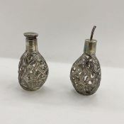 A pair of foreign silver mounted oil and vinegar decanters, bamboo leaf decorated, mark to base