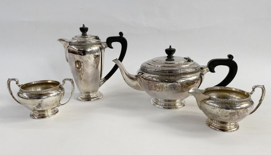 1940's silver four piece tea set, the teapot and coffee pot both with ebony finials and handles, all