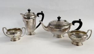 1940's silver four piece tea set, the teapot and coffee pot both with ebony finials and handles, all