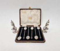 Set of six bean-topped coffee spoons, in case and a pair of sterling silver salt and pepper,