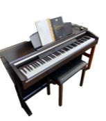Yamaha Clavinova CLP-130 electric piano in dark wood stained case and the matching black-topped
