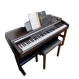 Yamaha Clavinova CLP-130 electric piano in dark wood stained case and the matching black-topped