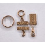 Three various 9ct gold mounts, engraved, a 9ct gold clip (gross weight approx. 5.8g) and a gold-
