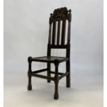 Antique stained wood Carolean-style side chair having ornate scroll and floral carved toprail,