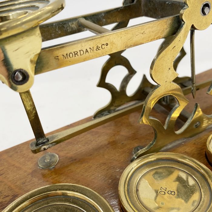 Set of late 19th century Sampson Mordan and Co. postal scales, with seven graduated weights on oak - Image 2 of 4