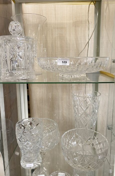 Various cut glass items to include two pudding bowls, two vases, a celery vase, a biscuit barrel and