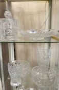 Various cut glass items to include two pudding bowls, two vases, a celery vase, a biscuit barrel and