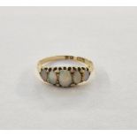 Gold-coloured metal and opal dress ring set five graduated opals, claw set (some wear to the