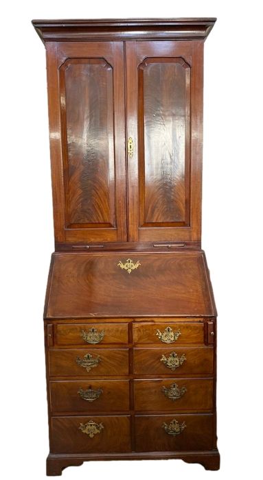 George III mahogany bureau bookcase, the top section with cavetto frieze, three adjustable