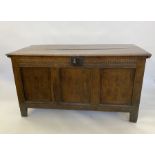 Large antique oak coffer having quadrant mould edge, scroll carved frieze, triple framed panel