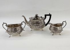 EPNS part tea service comprising teapot, sugar bowl and cream jug, on cabriole pad feet, gadrooned