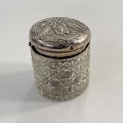 Edwardian silver-mounted cut glass trinket box, repousse decorated with pair of herons, Birmingham