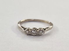 Silver-coloured metal, possibly platinum, three-stone diamond ring, diamonds 2mm approx. each. 1.