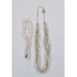 Seed pearl necklace within six strands, with gold-coloured metal fine chain clasp and length of