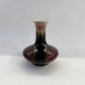 Chinese porcelain vase with flared squat base and tall neck, with striped peach and dark glazes,