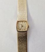 Mid 20th century lady's Omega 9ct gold wristwatch, the rounded square champagne face with integral