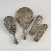 Art Nouveau silver-mounted four-piece dressing set by Walker & Hall, Chester 1911, repousse