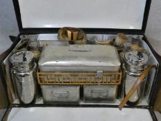 An early 20th century Drew & Sons, Picadilly, En-Route picnic set in twin handled fitted carrying