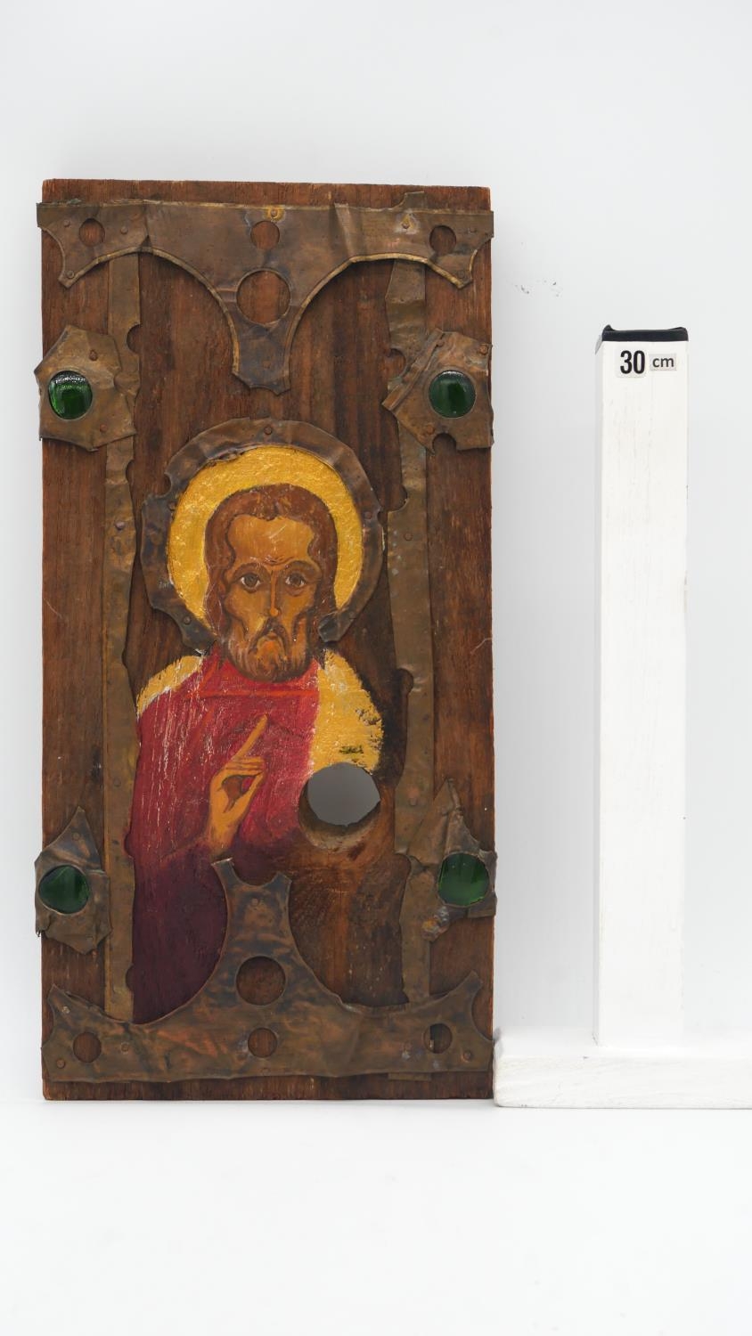 A painted religious idol on wood panel, with copper and green glass detailing. H.37 W.18cm - Image 4 of 4