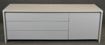 A contemporary lacquered Puntmobles sideboard fitted with drawers and cupboards. H.55 W.155 D.50cm