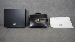 A Mont Blanc black leather lockable messenger bag with shoulder strap. Accompanied with original box