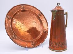 A WMF Art Nouveau copper and brass foliate design jug and circular charger. Ostrich makers stamp