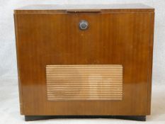 A vintage teak floor standing Ekco radiogram and record player. H.72 W.83 D.39cm