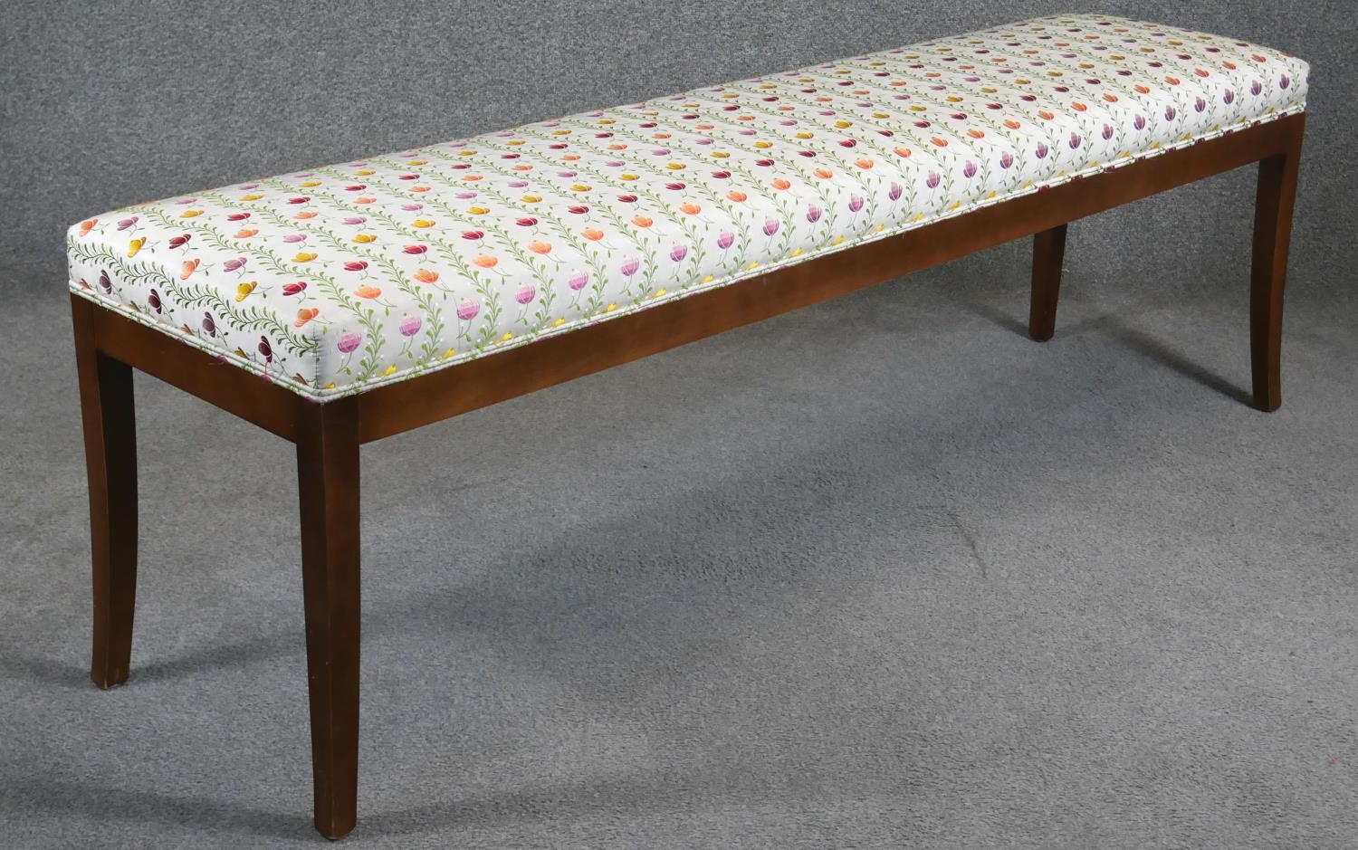 A contemporary window seat in piped floral upholstery on slender sabre supports. H.50 L.160 D.40cm - Image 2 of 4