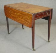 A 19th century mahogany, satinwood and ebony strung drop flap Pembroke table on square tapering