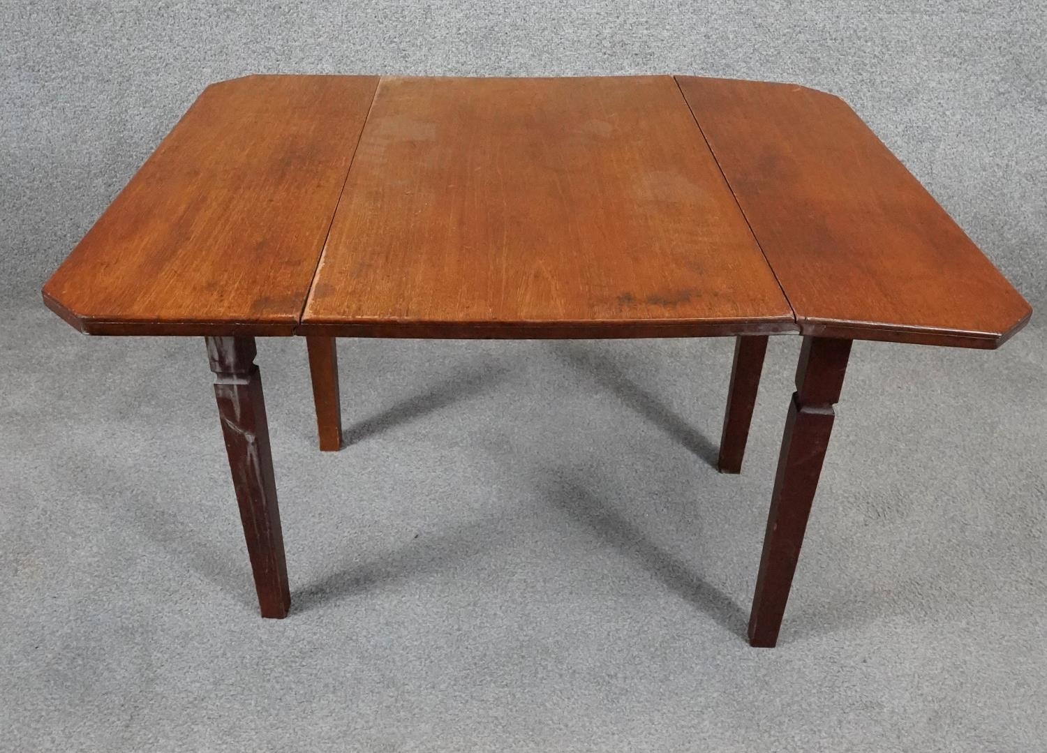 A 19th century mahogany drop flap table on square tapering supports. H.46 W.75 D.61cm - Image 4 of 6