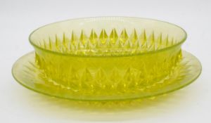 A Victorian Uranium vaseline moulded glass diamond pattern bowl and matching plate, both with star