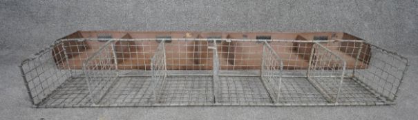 A vintage metal industrial style postal rack along with a similar mesh example. H.18 W.114 D.23cm