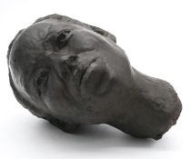 A sculpted bronze head of a female figure. Unsigned. H.35cm