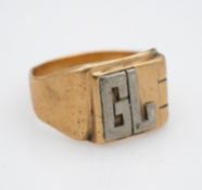 A 14 carat white and yellow gold signet ring with the initials GL applied in white gold, stamped