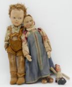Three antique dolls. One Scottish with tartan kilt and beret, an Austrian doll in traditional