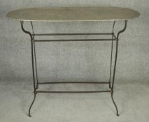 A metal framed console table with zinc top. H.90 L.110 D.45cm